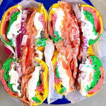 Queens Bagels & Delicatessen - Specialty Rainbow Bagel loaded with lox, capers, onion, tomato and cream cheese - Bagels Near Me - Forest Hills, New York