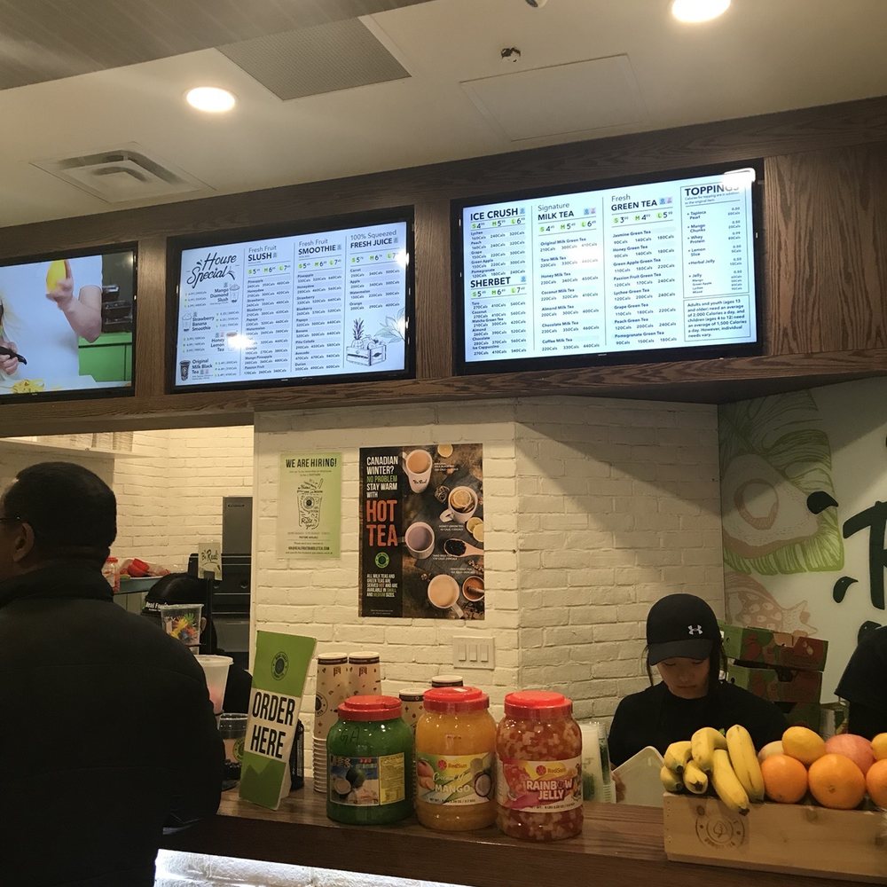 Real Fruit Bubble Tea - a man and a woman at a counter - Coffee & Tea Near Me - Mississauga, Ontario Real Fruit Bubble Tea - a man and a woman at a counter - Coffee & Tea Near Me - Mississauga, Ontario