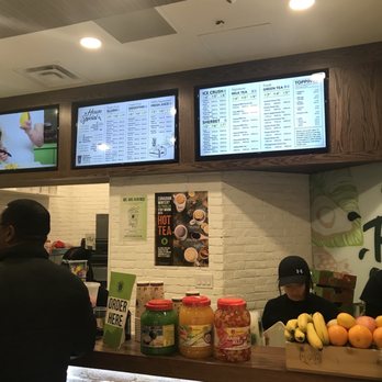 Real Fruit Bubble Tea - a man and a woman at a counter - Coffee & Tea Near Me - Mississauga, Ontario