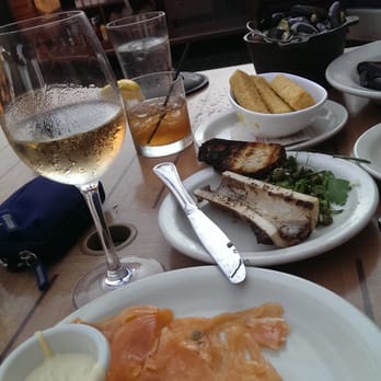 Prima Bistro - From front to back: house smoked salmon, roasted bone marrow, chick pea fries, small (!) bucket of Penn Cove mussels. - American Near Me - Langley, Washington