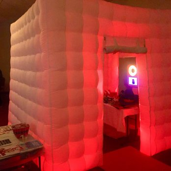 Pixel Candy Productions - LED Booth glowing red like Rudolphs nose at the corporate christmas party. Pick a color for your event theme. - Photo Booth Rentals Near Me Pixel Candy Productions - LED Booth glowing red like Rudolphs nose at the corporate christmas party. Pick a color for your event theme. - Photo Booth Rentals Near Me