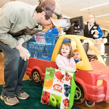 Adams Hometown Market - a man pushing a child in a toy truck - Grocery Near Me - Adams, Massachusetts Adams Hometown Market - a man pushing a child in a toy truck - Grocery Near Me - Adams, Massachusetts