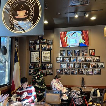 Capitol Cafe - two people sitting at a table - Coffee & Tea Near Me - Austin, Texas