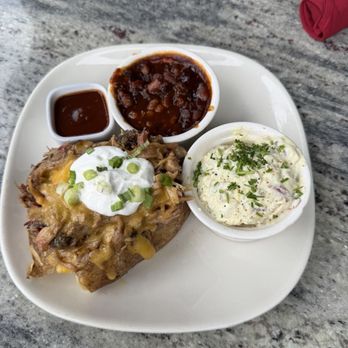 Jack Stack Barbecue - Freight House - Pulled pork Loaded Baked Potato. - Barbeque Near Me - Kansas City, Missouri Jack Stack Barbecue - Freight House - Pulled pork Loaded Baked Potato. - Barbeque Near Me - Kansas City, Missouri