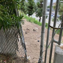 It is chain link. It has been pulled apart. It is chain link. It has been pulled apart.