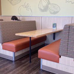 Taco Time - Dirty table with manager conducting an interview at the table behind.