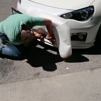 Bellevue Collision Center - Staff fixing the paint bubble between the plastic and aluminum - Body Shops Near Me - Bellevue, Washington Bellevue Collision Center - Staff fixing the paint bubble between the plastic and aluminum - Body Shops Near Me - Bellevue, Washington