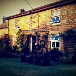 The Golden Lion Inn - Quite literally the 'Golden' Lion. Summers evening sunset.