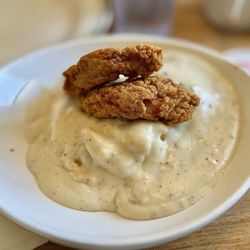 Jus' Jo's - Chicken Strips Biscuit and Gravy Bowl. So dang delicious and so much for the price. The crispy batter offsets all the soft savoriness.