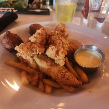 Pub W - Chicken tenders with hush puppies and fries - American Near Me - Oklahoma City, Oklahoma Pub W - Chicken tenders with hush puppies and fries - American Near Me - Oklahoma City, Oklahoma