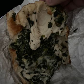 Sbarro - a person holding a piece of pizza - Pizza Near Me - Chicago Ridge, Illinois