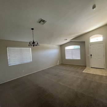 Tricon Residential - Living room area just dark picture - Real Estate Services Near Me