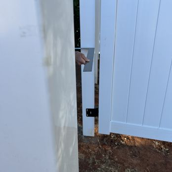 Shasta Fencing - this gate post and fence panels aren't perpendicular to the post in the foreground - Fences & Gates Near Me - Anderson, California