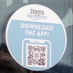 Posted on the drive-through window: QR code link to their customer loyalty program