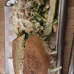 Chicken salad sandwich with a side of Brussel sprouts Chicken salad sandwich with a side of Brussel sprouts