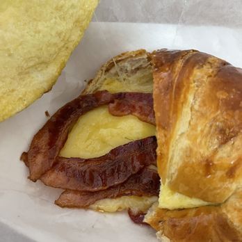 Swiss Donuts - Bacon, egg and cheese croissant served in a plastic bag. - Donuts Near Me - Palm Desert, California Swiss Donuts - Bacon, egg and cheese croissant served in a plastic bag. - Donuts Near Me - Palm Desert, California