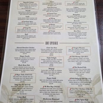 QQ Kitchen - The menu from QQ Kitchen displays a variety of Asian dishes including tofu, chicken, pork, beef, and shrimp, with prices ranging from $14.99 to $17.99. It features appetizers, chef specials, and options for different dietary preferences, with detailed descriptions of each dish. The menu emphasizes the use of white rice and offers additional options for fried rice and side dishes. It is set in a typical restaurant menu layout with clear sections and pricing. - Chinese Near Me - Toledo, Ohio