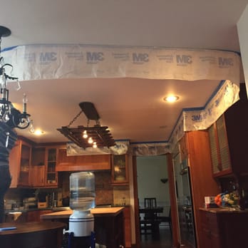 G Nieto Drywall - Prepping the plastic barrier to prevent dust from being everywhere - General Contractors Near Me G Nieto Drywall - Prepping the plastic barrier to prevent dust from being everywhere - General Contractors Near Me