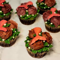 Chaqueta Cakes - Mini rose cupcakes with non dairy white chocolate mermaid tails.