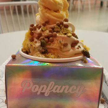 Popfancy Dessert Bar - This was my first creation. Mango mixed in flurry vanilla ice cream with pistachios and salted caramel crisps. Drizzle with berry sauce. - Desserts Near Me - Houston, Texas