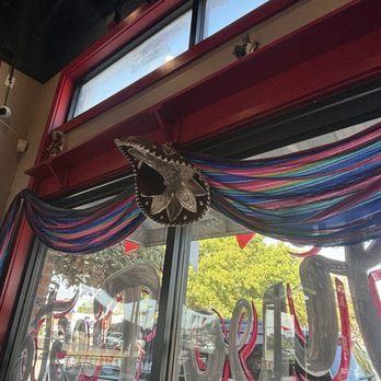 Taqueria El Patron - Colorful serape with sombrero dress all the windows - Mexican Near Me - San Antonio, Texas Taqueria El Patron - Colorful serape with sombrero dress all the windows - Mexican Near Me - San Antonio, Texas
