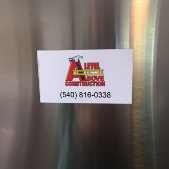 A Level Above Construction - a sticker on a stainless steel refrigerator - General Contractors Near Me - Moneta, Virginia