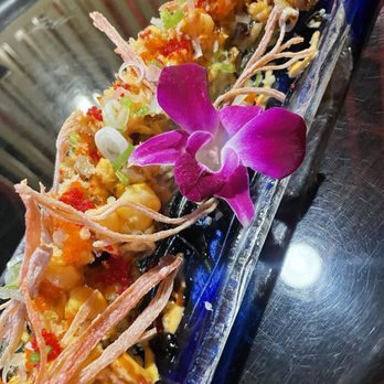 Tokyo Moon OKC - a plate of sushi with a purple flower - Sushi Bars Near Me - Oklahoma City, Oklahoma