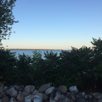 Baileys 57 - Sunsetting on Baileys Harbor bay. Hard to believe we're dining 'al fresco' next to a gas station. Only in Door county! - Gas Stations Near Me - Baileys Harbor, Wisconsin