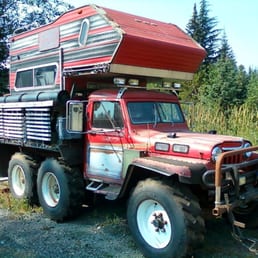a truck with a camper on top a truck with a camper on top