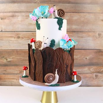 Glace Cakes - a three tiered cake with a snail on top - Custom Cakes Near Me