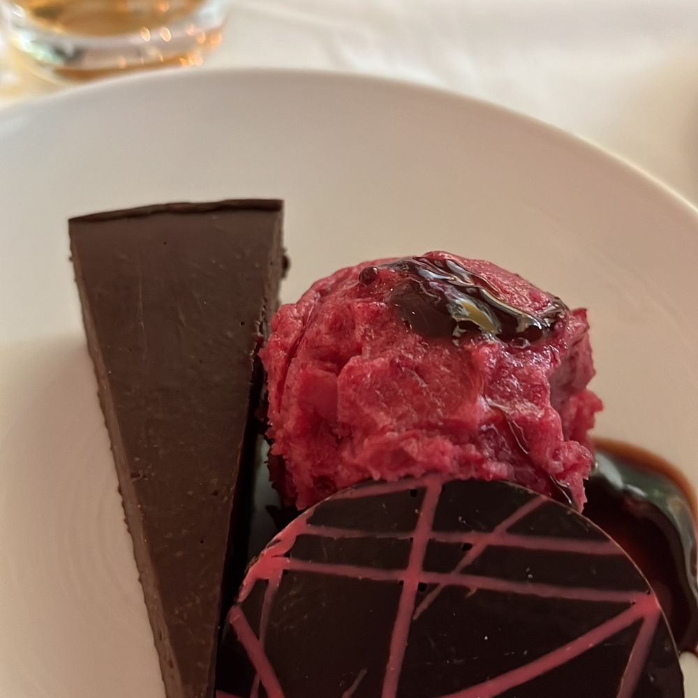 The Class Act - Flourless chocolate cake with sherbet - New American Near Me - Cedar Rapids, Iowa The Class Act - Flourless chocolate cake with sherbet - New American Near Me - Cedar Rapids, Iowa