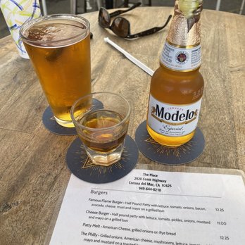 The Place - a drink and a menu on a table - Sports Bars Near Me - Corona Del Mar, California The Place - a drink and a menu on a table - Sports Bars Near Me - Corona Del Mar, California