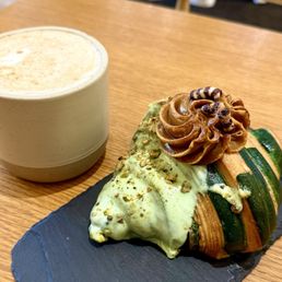 Pistachio croissant and Mufawar Coffee Pistachio croissant and Mufawar Coffee