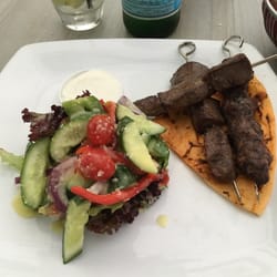 Sahra by the River - Lamb skewers and salad