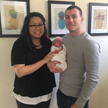 Dara The Doula - Just a few days back from the hospital, holding our little girl who arrived with Dara's invaluable help! - Doulas Near Me