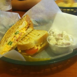 Pimento cheese panini with spicy bacon and tomato. Potato salad on the side. Pimento cheese panini with spicy bacon and tomato. Potato salad on the side.