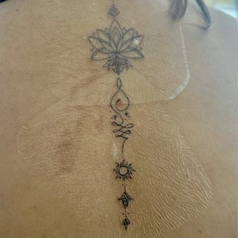 Kapwa Ink - Lotus spine tattoo by Kapwa Ink! - Tattoo Near Me - San Leandro, California