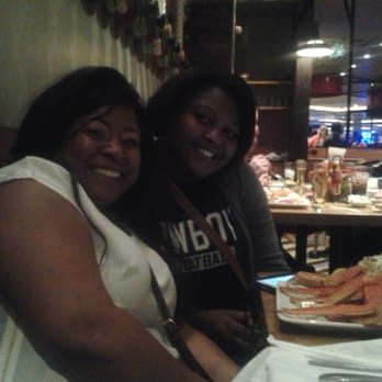 Buffet Americana - Seafood buffet on Friday night.  Adrina and Sheila enjoying some crab legs1 - Buffets Near Me - Tunica Resorts, Mississippi