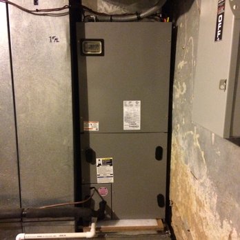 Cornelius Contracting HVAC - a water heater in a basement - Heating & Air Conditioning/HVAC Near Me - Country Club, Missouri