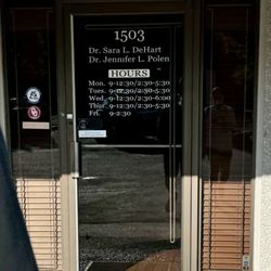 DeHart Chiropractic Clinic - Front door with hours of operation.