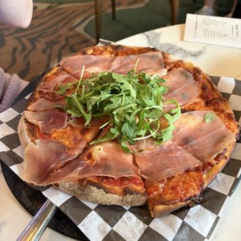 Piece Out Del Ray - My friend got this, can't recall but that looks like prosciutto :) - Pizza Near Me - Alexandria, Virginia Piece Out Del Ray - My friend got this, can't recall but that looks like prosciutto :) - Pizza Near Me - Alexandria, Virginia