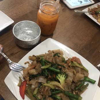 Muay Thai Kitchen - Vegetable pad se ew with Thai tea and a beautiful cup for water. - Thai Near Me - San Marcos, California