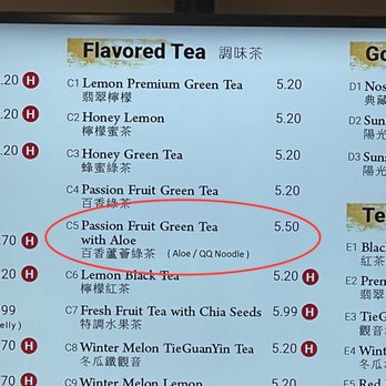 TP Tea - Screen-based menu shows Passion Fruit Green Tea with Aloe but also includes QQ Noodle - A digital menu board features a list of flavored teas, including Passion Fruit Green Tea with Aloe priced at $5.50. The menu includes Chinese translations for each item and highlights the tea names with different symbols. The board is part of a Taiwanese bubble tea shop, offering a variety of drinks with customizable options. - Bubble Tea Near Me - Richardson, Texas
