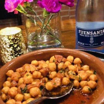 Next Corner Tapas & Bar - a bowl of chickpeas and a bottle of water - Mediterranean Near Me - Clewiston, Florida Next Corner Tapas & Bar - a bowl of chickpeas and a bottle of water - Mediterranean Near Me - Clewiston, Florida
