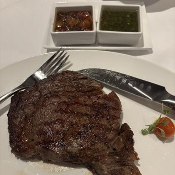 1832 Steakhouse - 18oz ribeye with bacon apricot gastrique and chimichurri - Steakhouses Near Me - Durant, Oklahoma