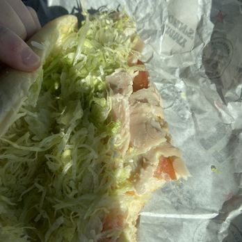 Jimmy John's - a hand holding a sandwich - Fast Food Near Me - Ellensburg, Washington