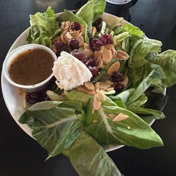 Silver Spring House Restaurant - mixed greens and topped with toasted almonds, goat cheese, dried cranberries and a side of basil vinaigrette. - American Near Me - Cincinnati, Ohio