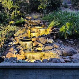 a waterfall in a garden a waterfall in a garden