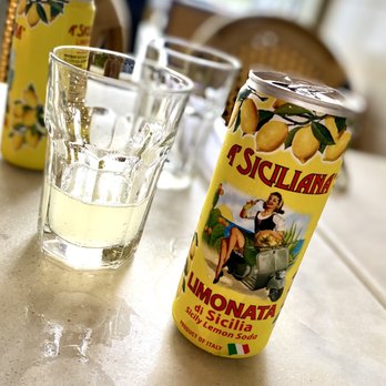 Capizzi - a can of lemonade next to a glass of water - Pizza Near Me - New York, New York Capizzi - a can of lemonade next to a glass of water - Pizza Near Me - New York, New York