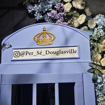 Per Se - a phone booth with flowers in the background - Salad Near Me - Douglasville, Georgia